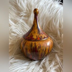 This vintage lidded jar appears to be a collectible art